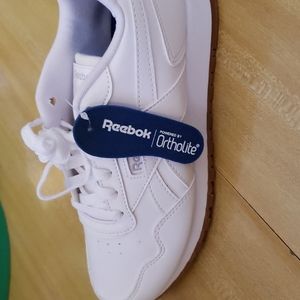 New white Reebok shoes.